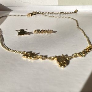 The Cats Meow Kate Spade gold necklace and earring set